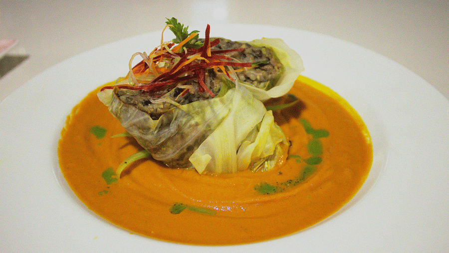 Delicately plated seafood in an orange sauce with fresh garnishes - Hotel 39, Jamaica