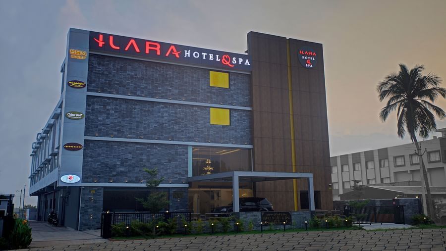 Facade of Ilara Hotels & Spa, Tada with a drive way in the foreground during the late evening hours.