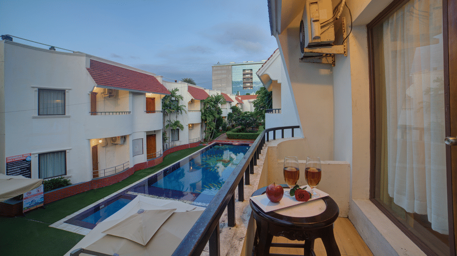 Balcony view of the property and poolside seating area at Ilara Hotels & Spa, OMR, Chennai.