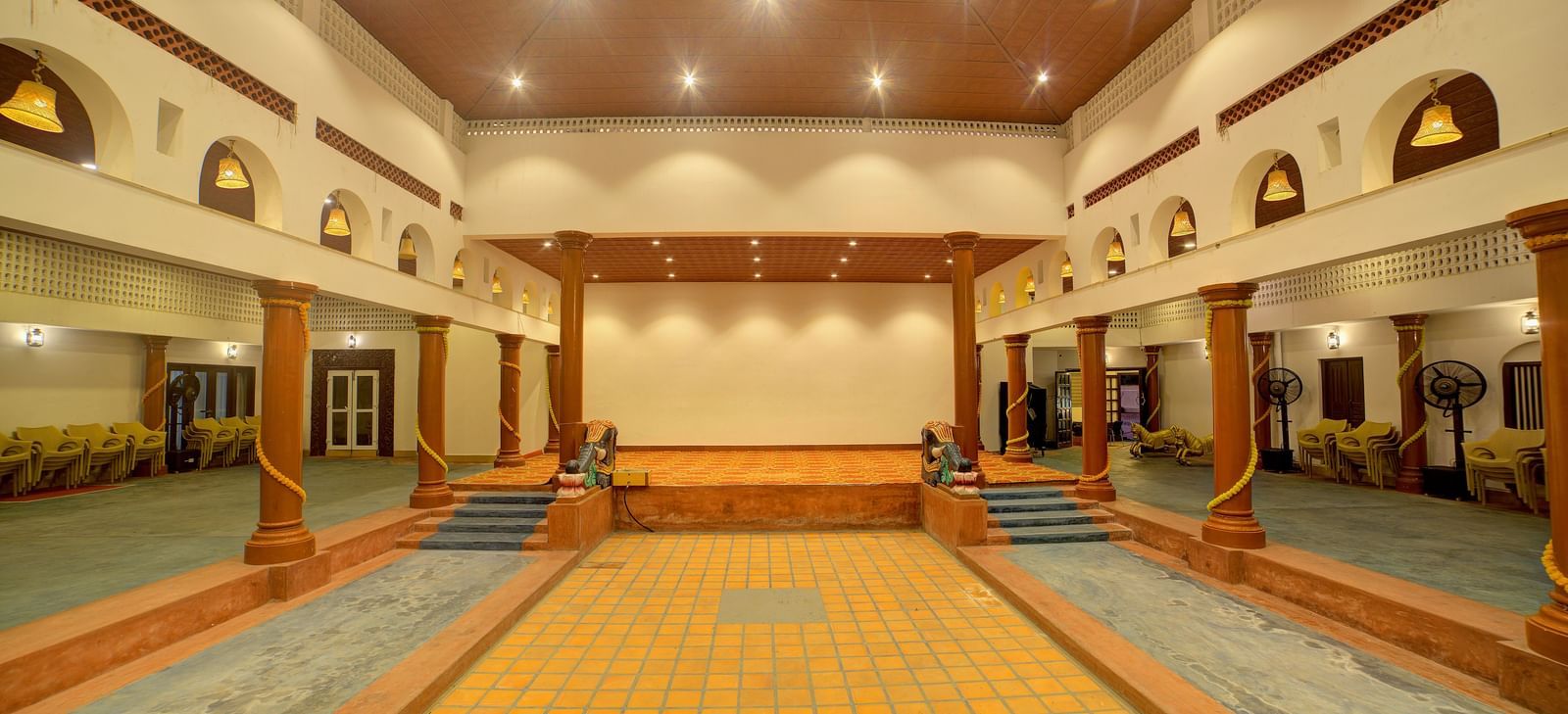 Spacious traditional hall with high ceilings and elegant arches at Kailash Conventions ECR.