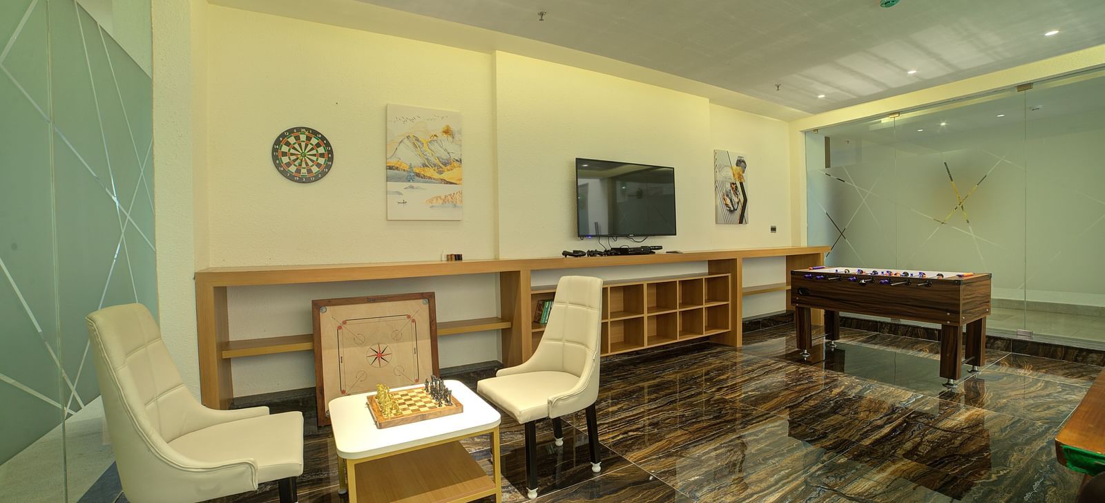 A Foosball table along with a chessboard at Ilara Hotels & Spa, Tada. 