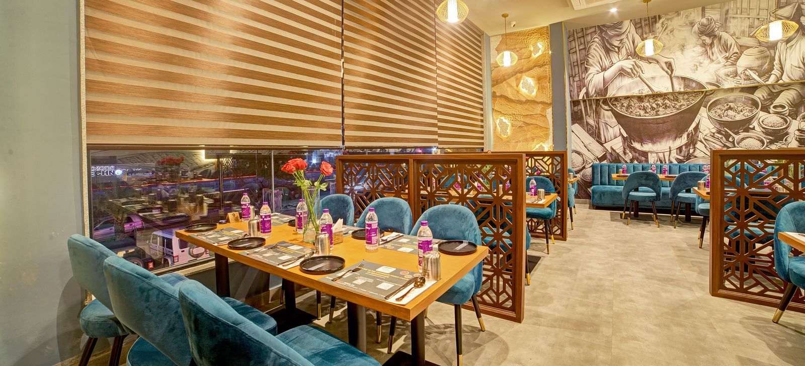 Chic restaurant interiors with wooden accents and floral centrepieces at Ilara Hotels & Spa, OMR, Chennai