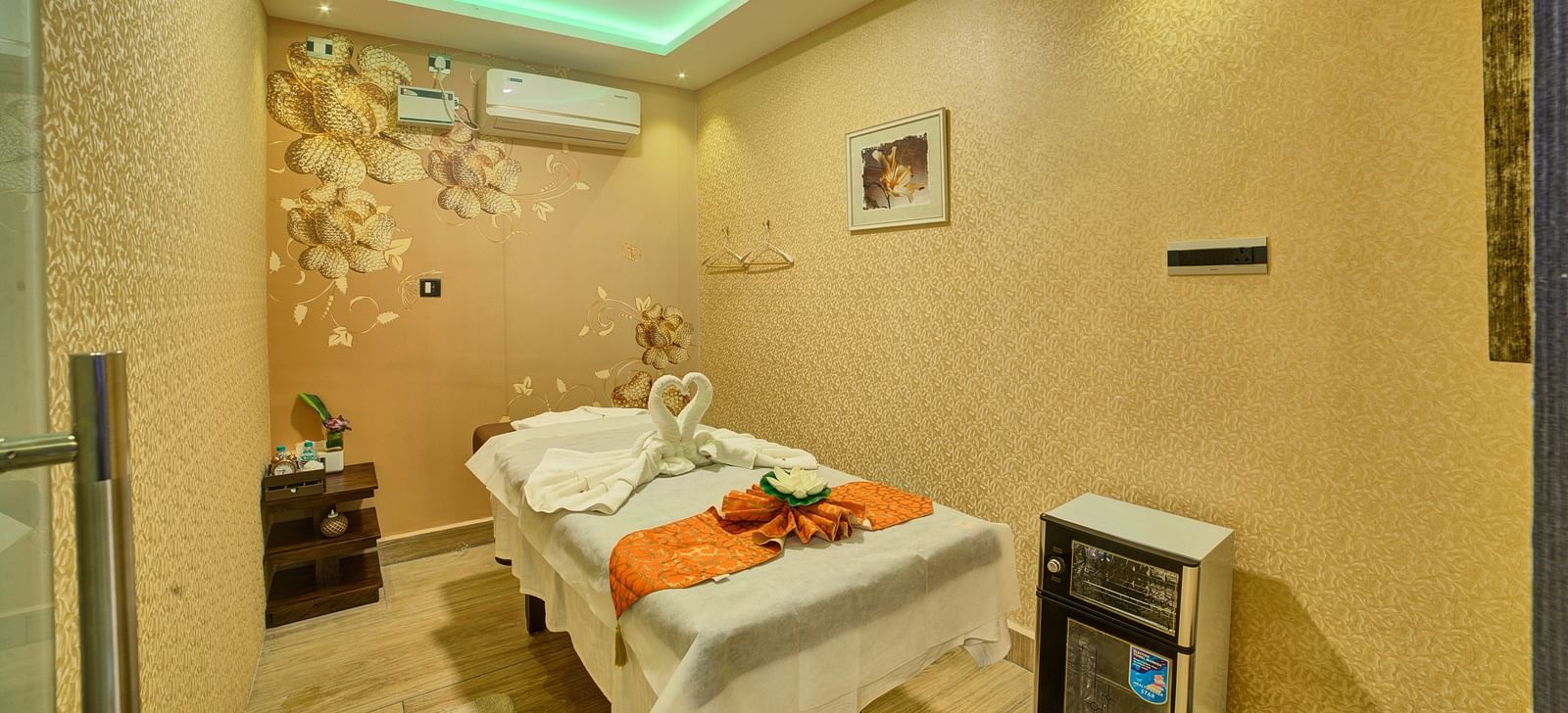 Corner view of a room featuring a spa table in the middle and a false ceiling above it at Ilara Hotels & Spa, Tada.
