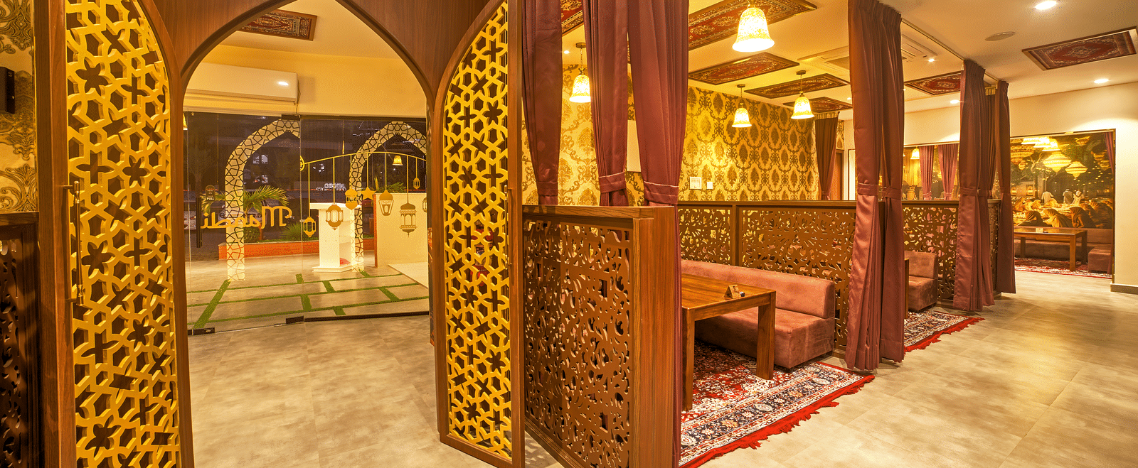 Royal-themed private dining area with intricate woodwork at Ilara Hotels & Spa, OMR, Chennai