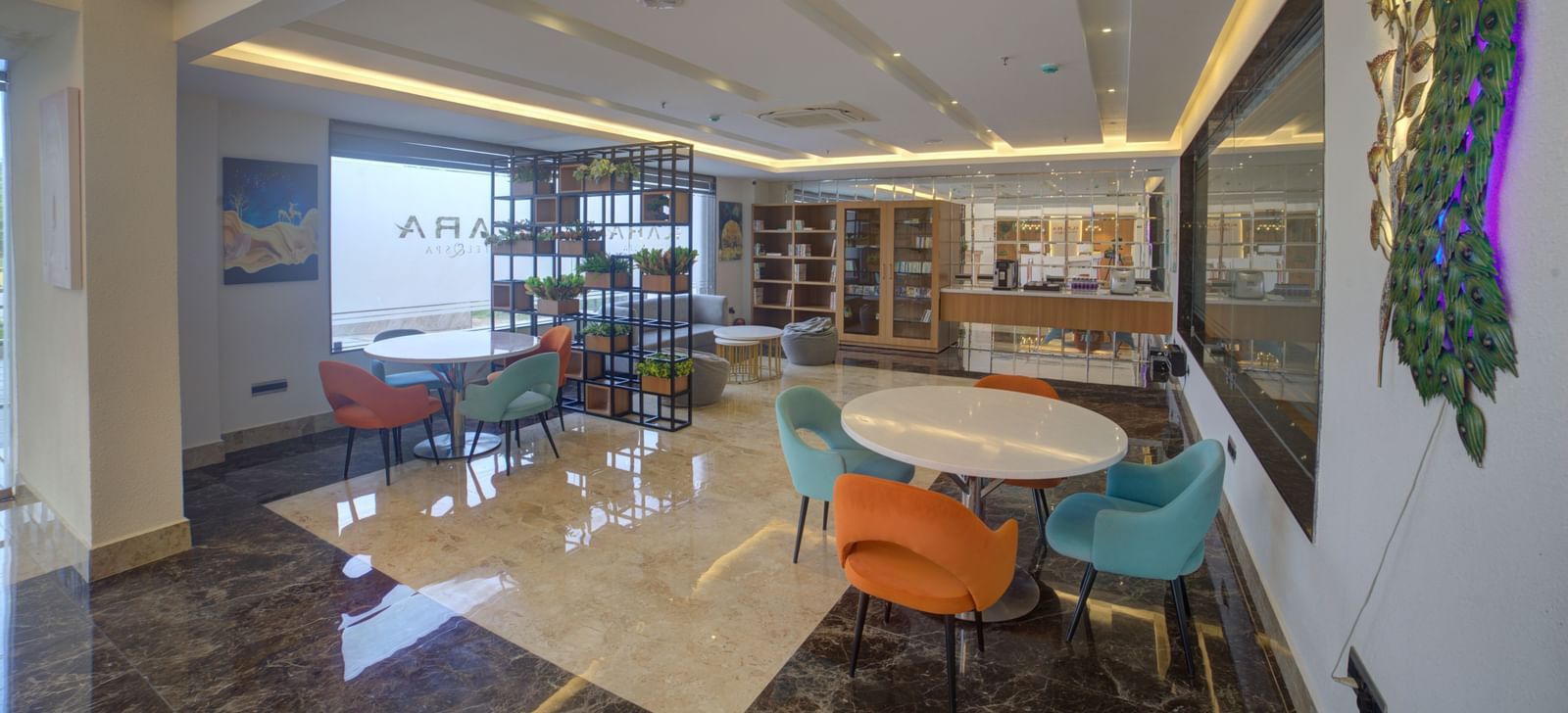 Full view shot of the lobby at Ilara Hotels & Spa, Tada with a common seating area. 