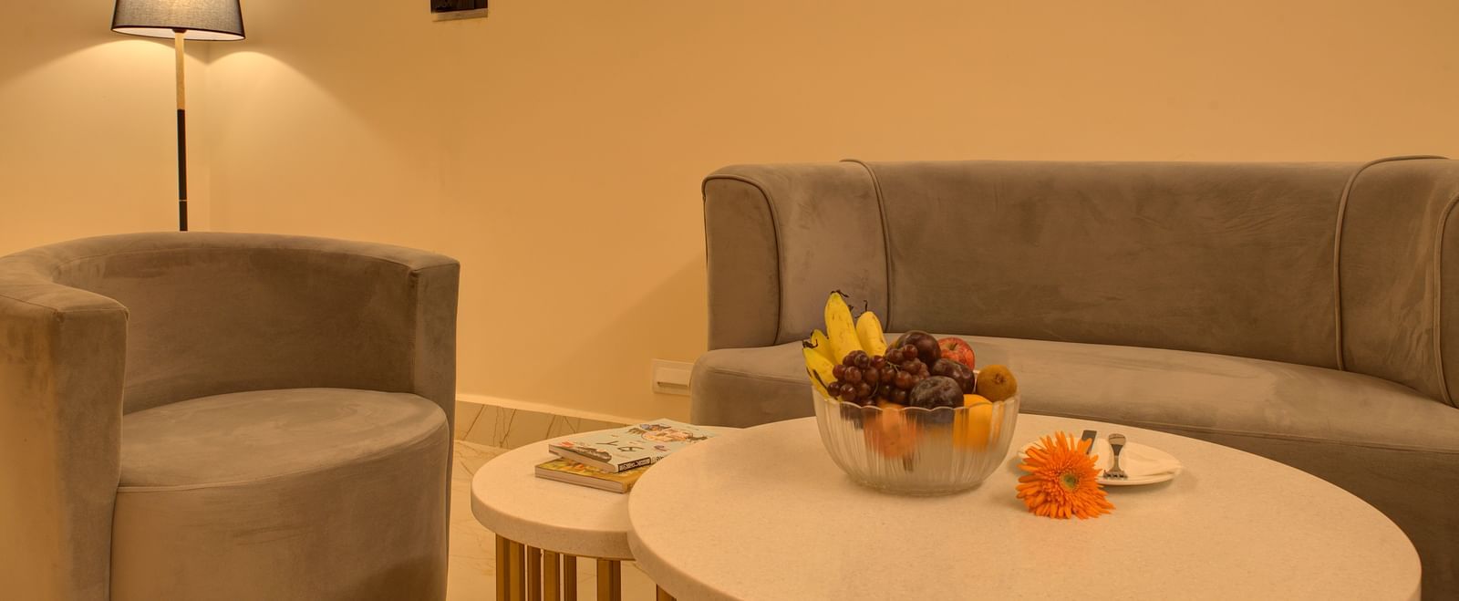 A close up shot of the coffee table in the living room of the Executive Suite with a fruit bowl at Ilara Hotels & Spa, Tada.