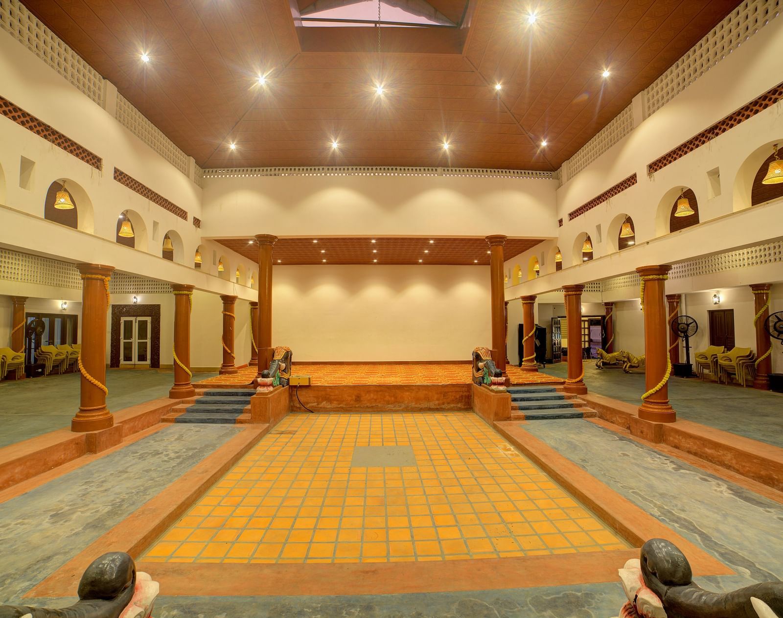 Spacious traditional hall with high ceilings and elegant arches at Kailash Conventions ECR.