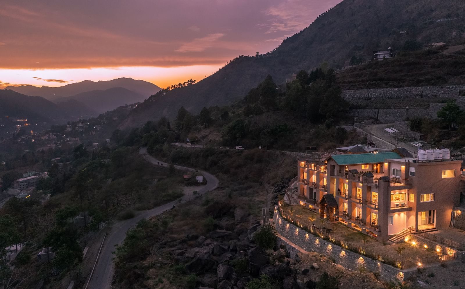 an image of long shot view of an image of a long shot view of Mountoria Retreat, Naukuchiatal in the evening