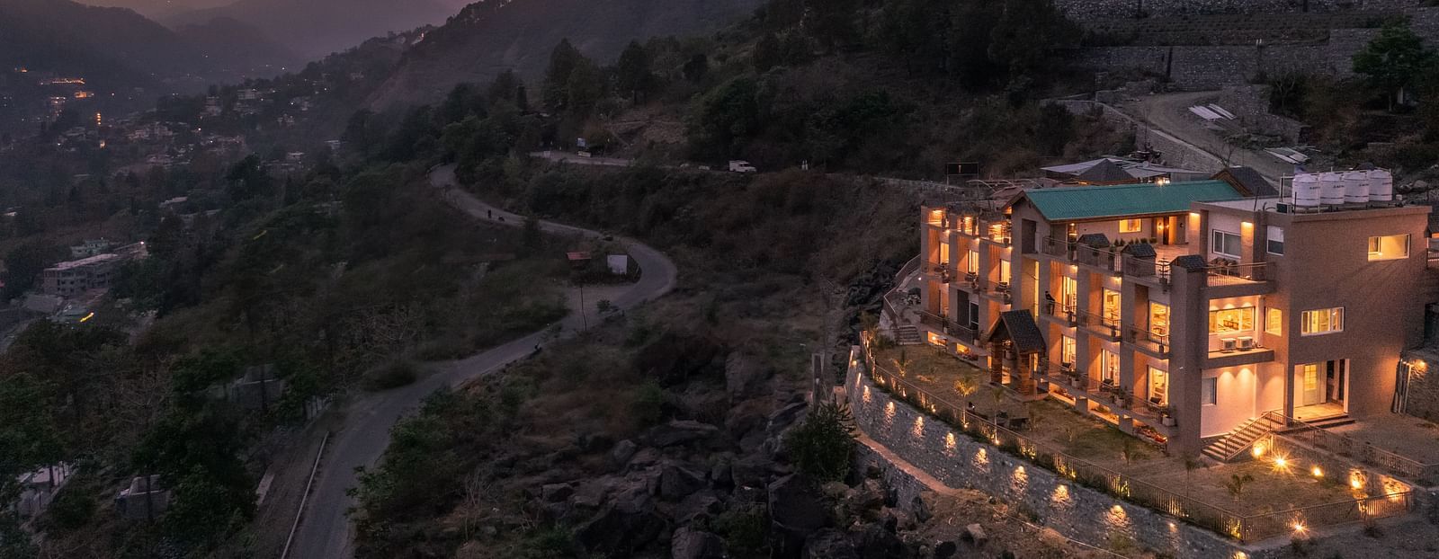an image of long shot view of an image of a long shot view of Mountoria Retreat, Naukuchiatal in the evening