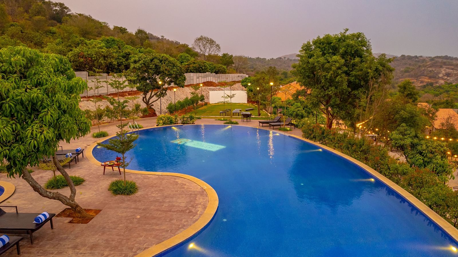 An aerial view of Ravishing Retreat featuring a large crystal blue swimming pool