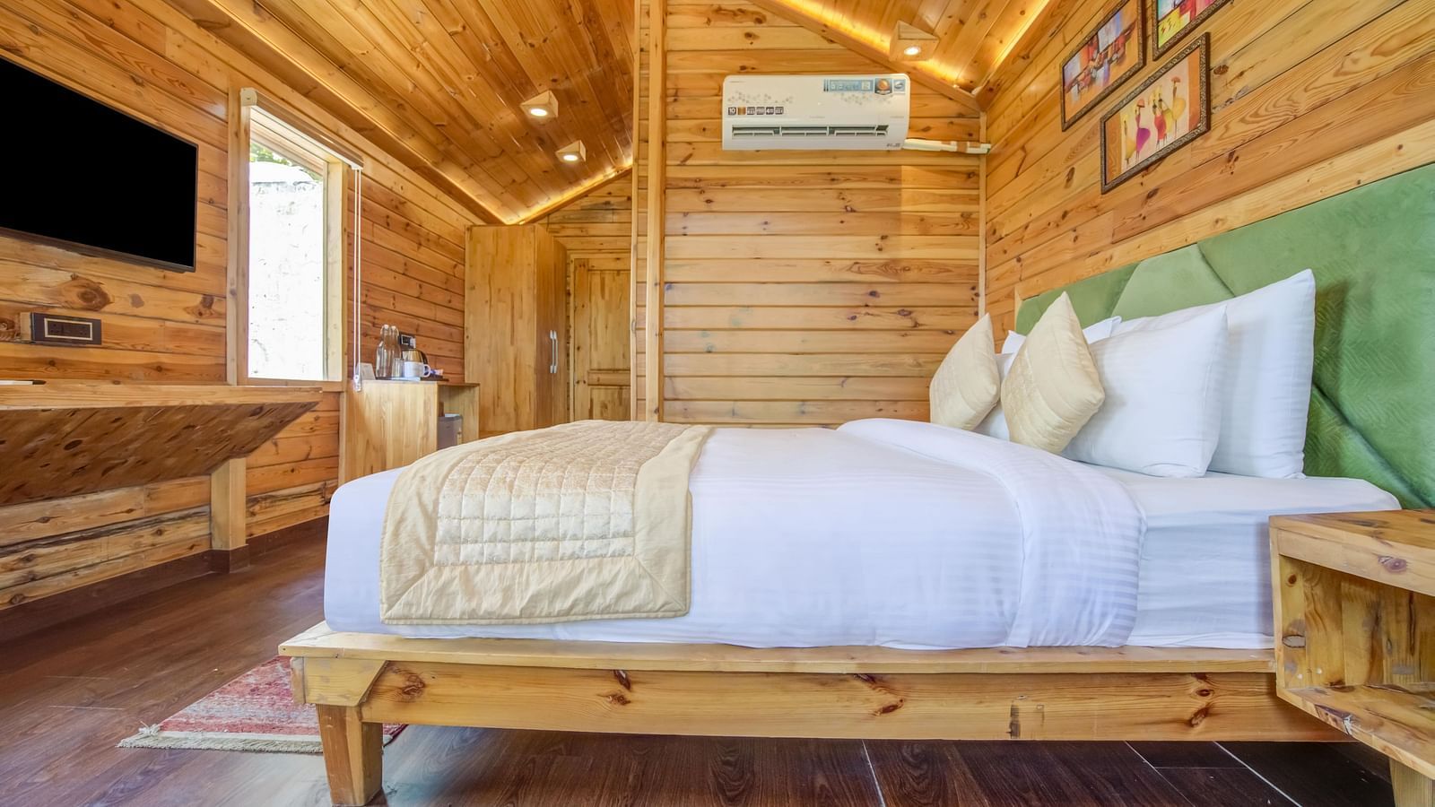 An image of a wooden bedroom which also has a flat screen TV  - Summit Jungle Resort, Lansdowne