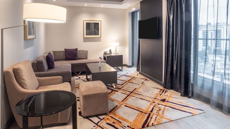 Modern living area with sofa, chairs, and natural light at Best Western Premier Westlands.