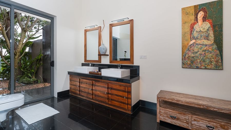 A chic bathroom with a wooden vanity, twin mirrors, and artistic decor that adds charm to the space - Suite with Private Pool at  Heavensa Villas and Suites by the Clarks, Galle