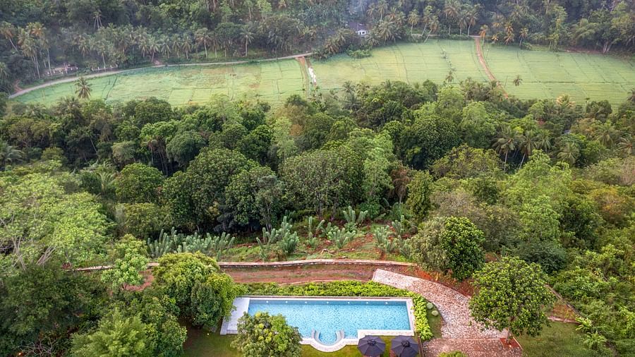 Birds eye view of a picturesque villa surrounded by verdant hills and trees, featuring a private swimming pool - Heavensa Villas and Suites by the Clarks, Galle