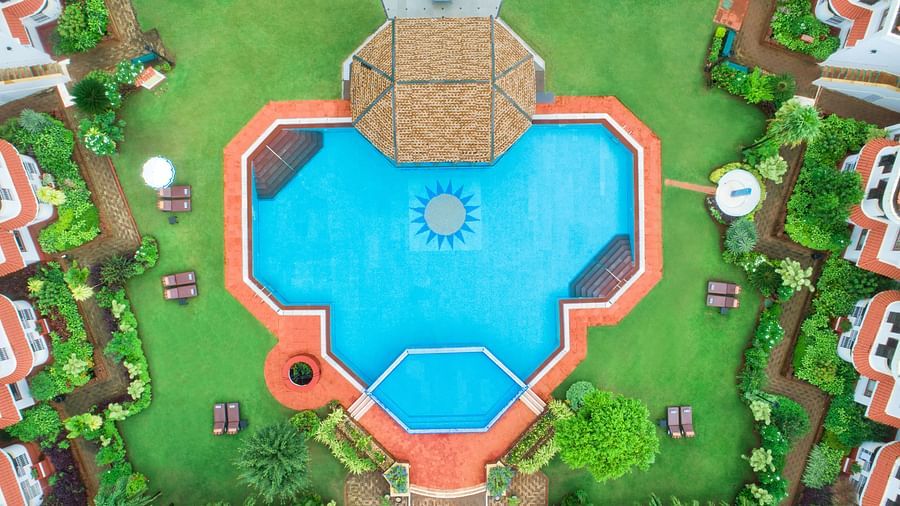 aerial view of our luxury resort with swimming pool in south goa - heritage village resort and spa