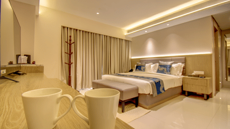 A hotel room with two beds, two mugs, and a view of the bathroom - The SSK Solitaire Boutique Hotel & Spa, Gangapur Road - Nashik