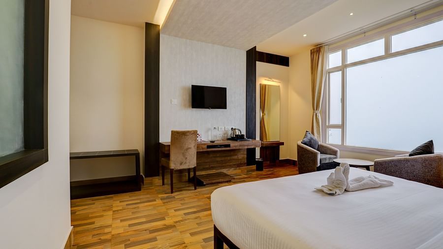 view of king size bed and TV of a Deluxe Room Banari Regency by Summit, Namchi