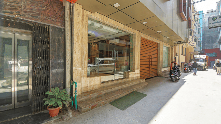 Ground-level view of the hotel entrance and elevator access from the street - Hotel Velocity