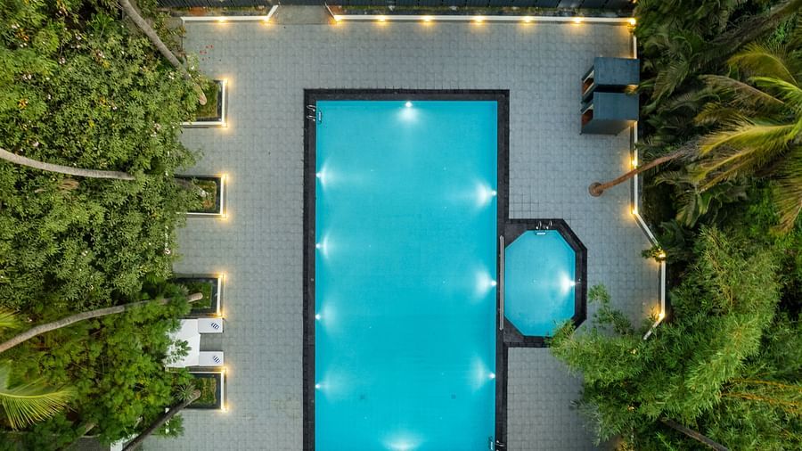 Aerial view of a swimming pool surrounded by greenery - Mango Hill Resort, Coimbatore
