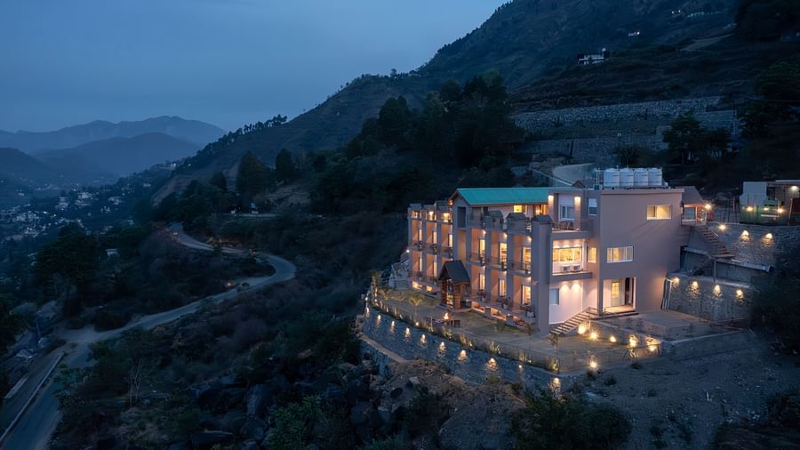 facade of Leisure Hotel at dusk 