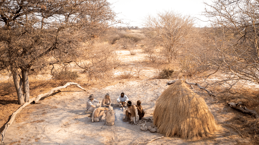 Guests experiencing a traditional Bushmen cultural demonstration near Evolve Back Kalahari