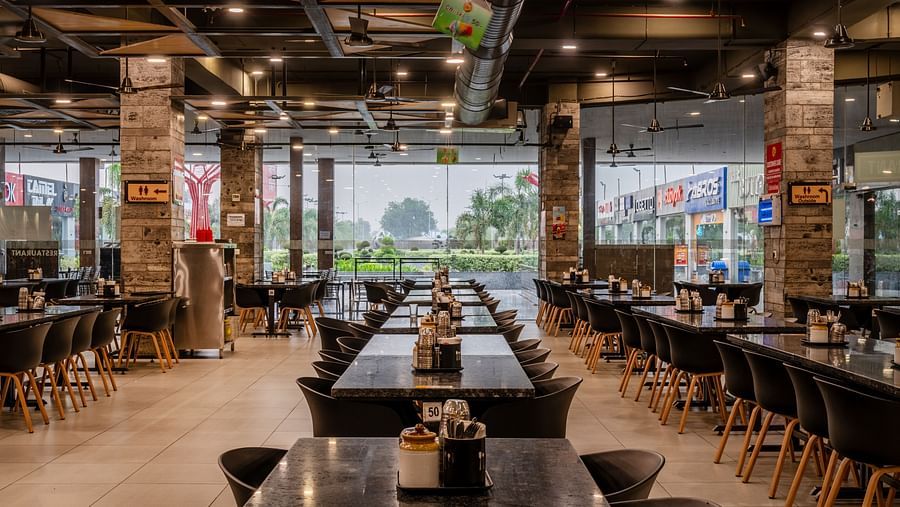 Restaurant seating area neatly arranged in elegant and simple manner at Hotel Highway King, Bilaspur