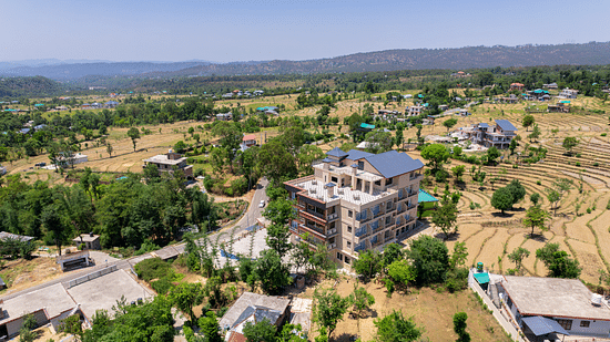 An aerial shot of aôtel by clarks inn, Palampur on a sunny day under clear sky