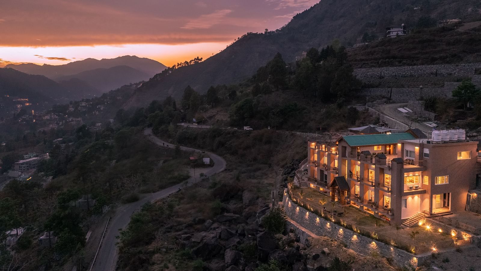 an image of long shot view of an image of a long shot view of Mountoria Retreat, Naukuchiatal in the evening