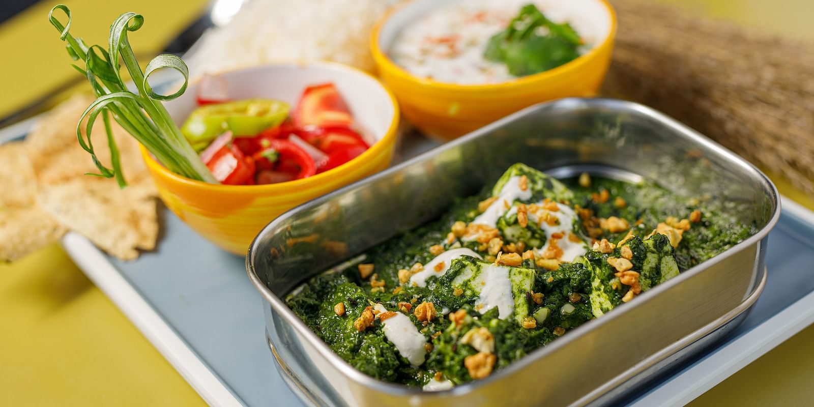 A platter of food with with different dishes - Bedzzz, Rishikesh