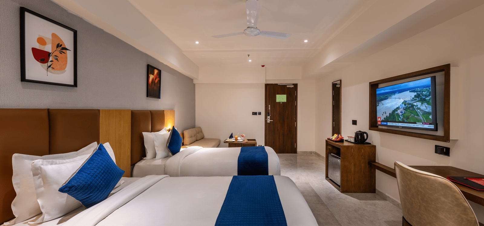 Bright and spacious accommodation with seating area and elegant interiors at Lords Studio Inn, Jamnagar.