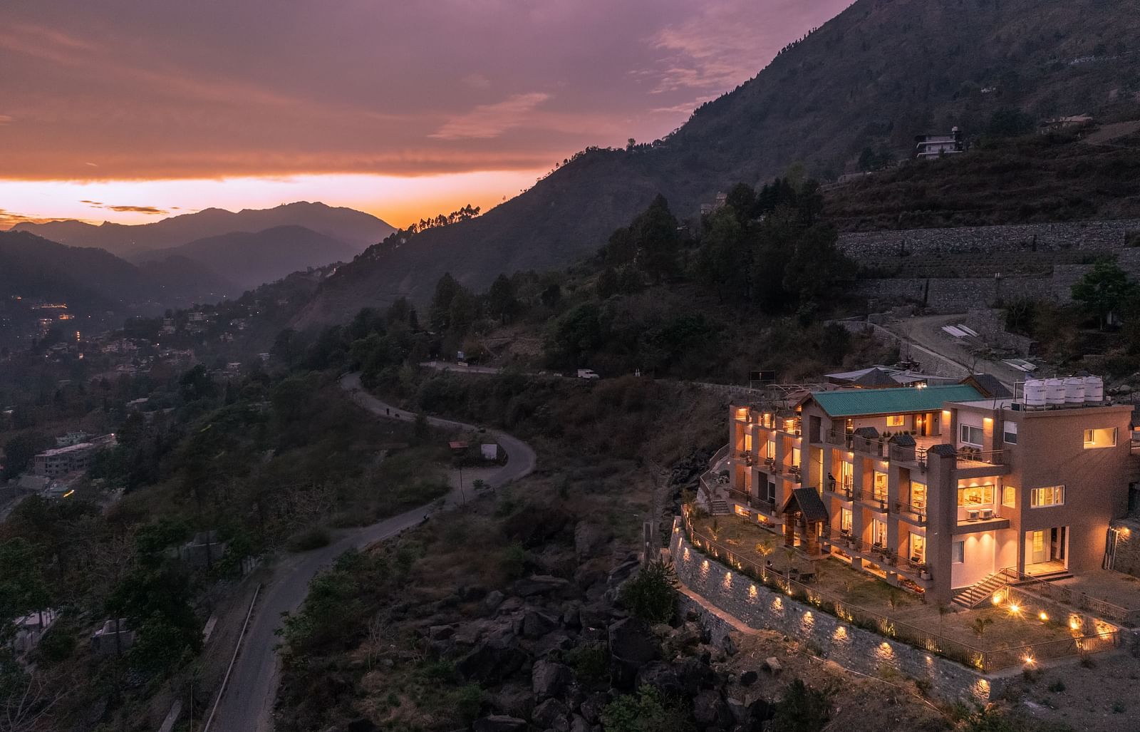 an image of long shot view of an image of a long shot view of Mountoria Retreat, Naukuchiatal in the evening