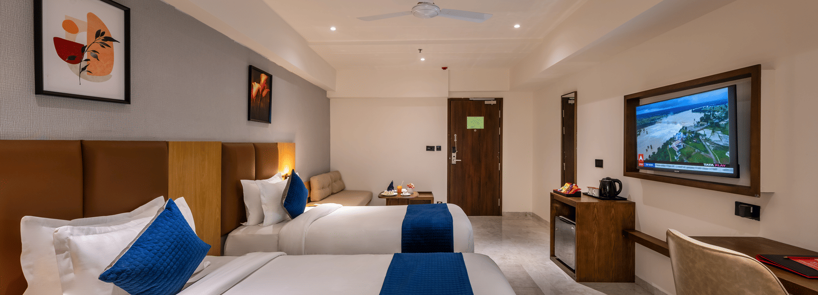 Bright and spacious accommodation with seating area and elegant interiors at Lords Studio Inn, Jamnagar.