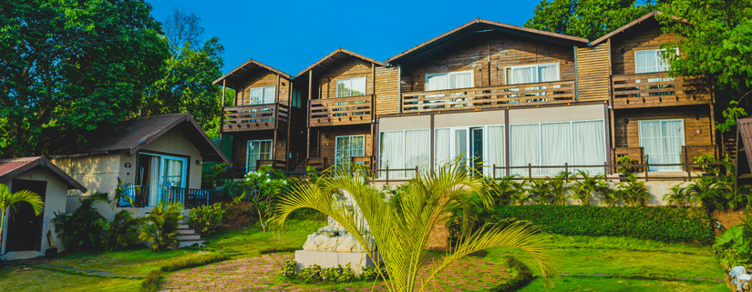The cottages at Stone Wood Resort & Spa embraced by trees and greenery 