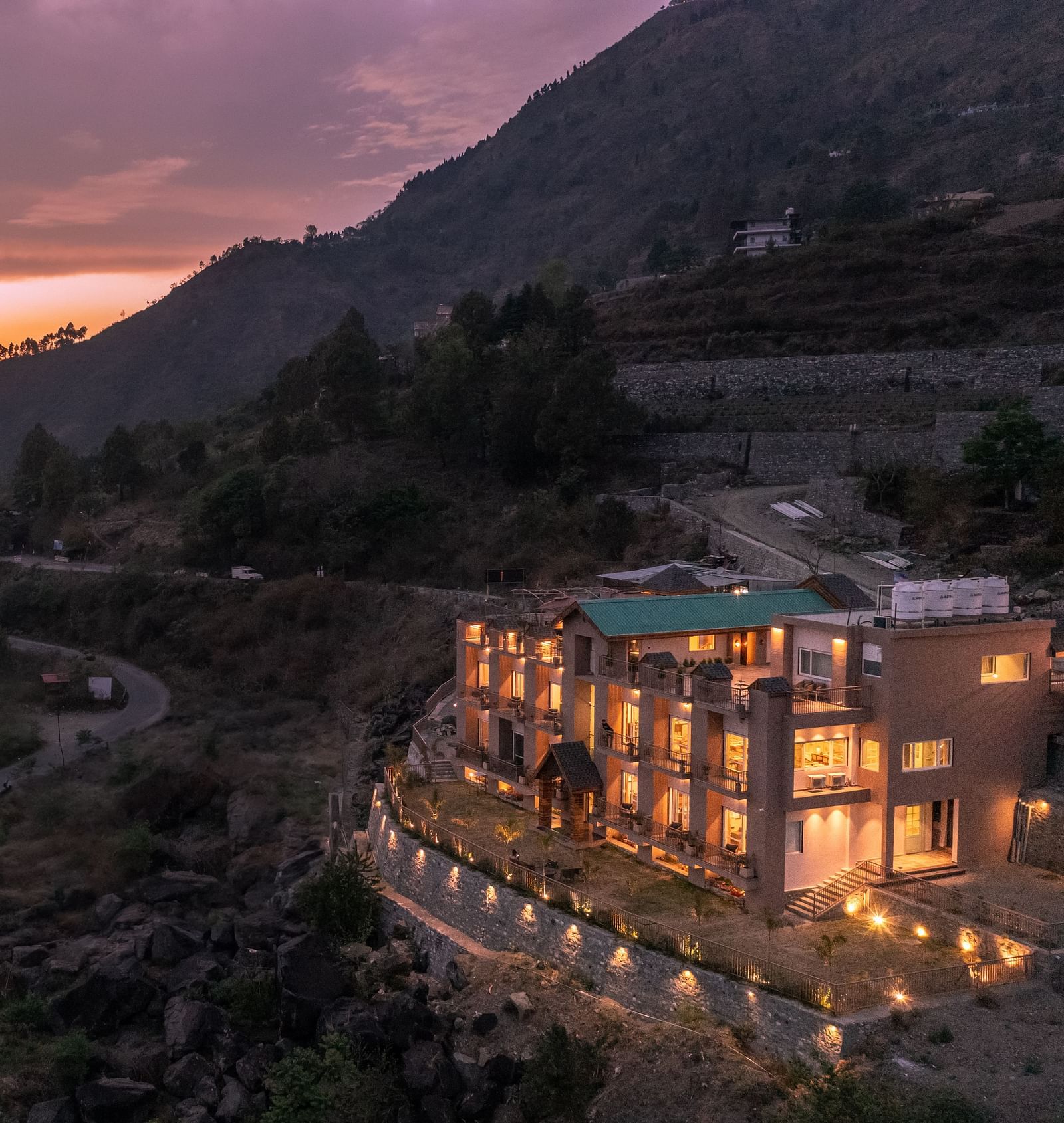 an image of long shot view of an image of a long shot view of Mountoria Retreat, Naukuchiatal in the evening