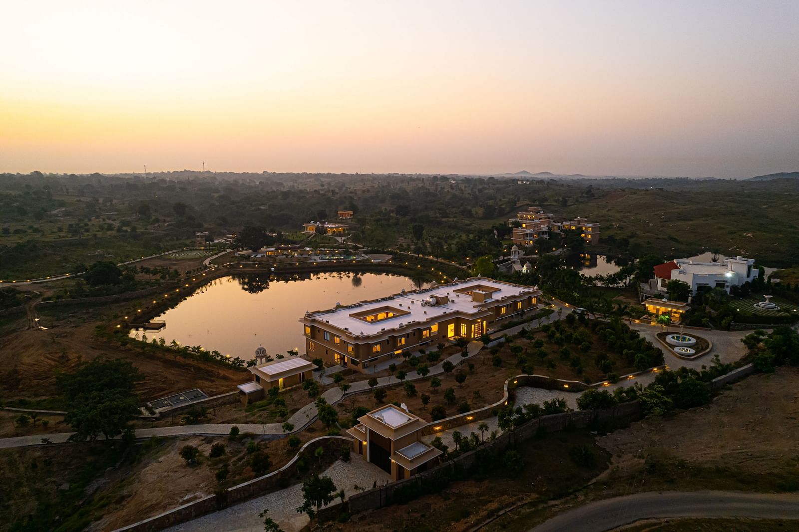 Aerial view of the wellness centre during twilight with serene views - Rajbagh Wellness