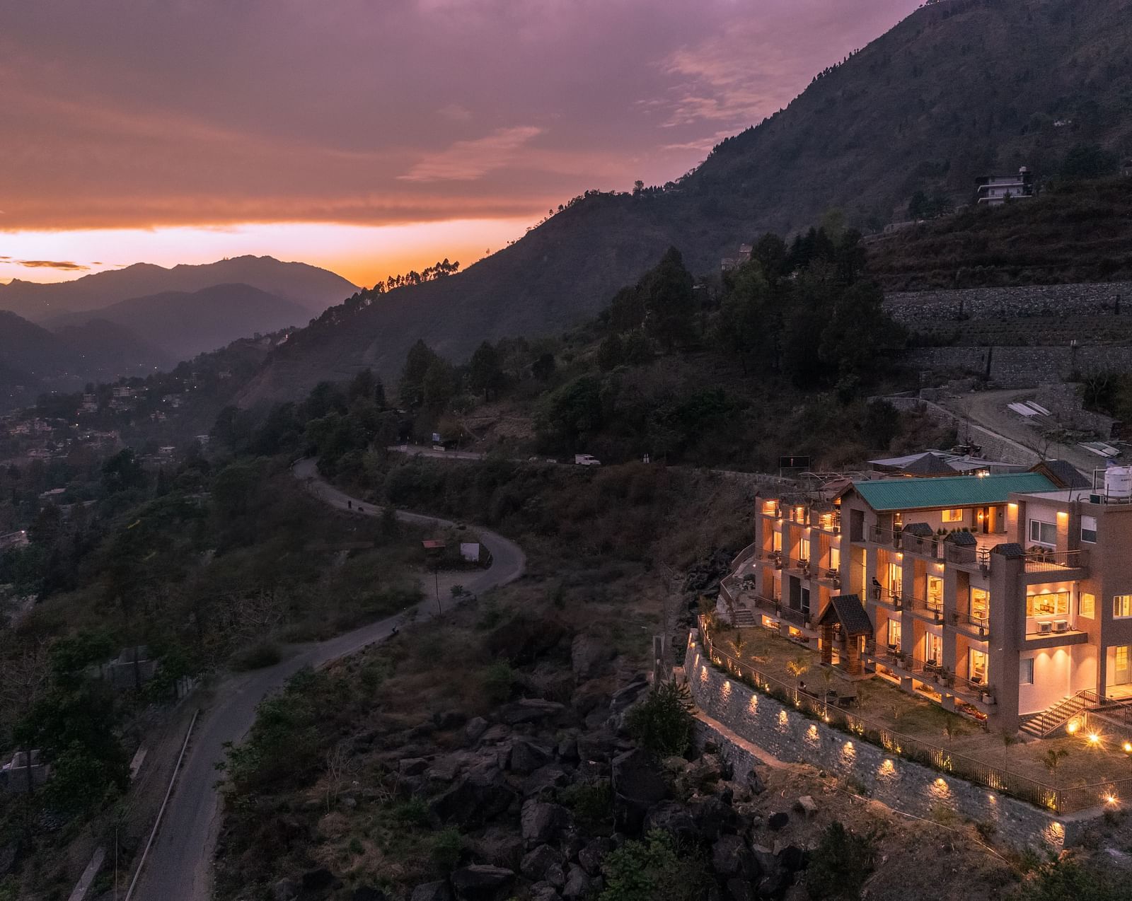 an image of long shot view of an image of a long shot view of Mountoria Retreat, Naukuchiatal in the evening