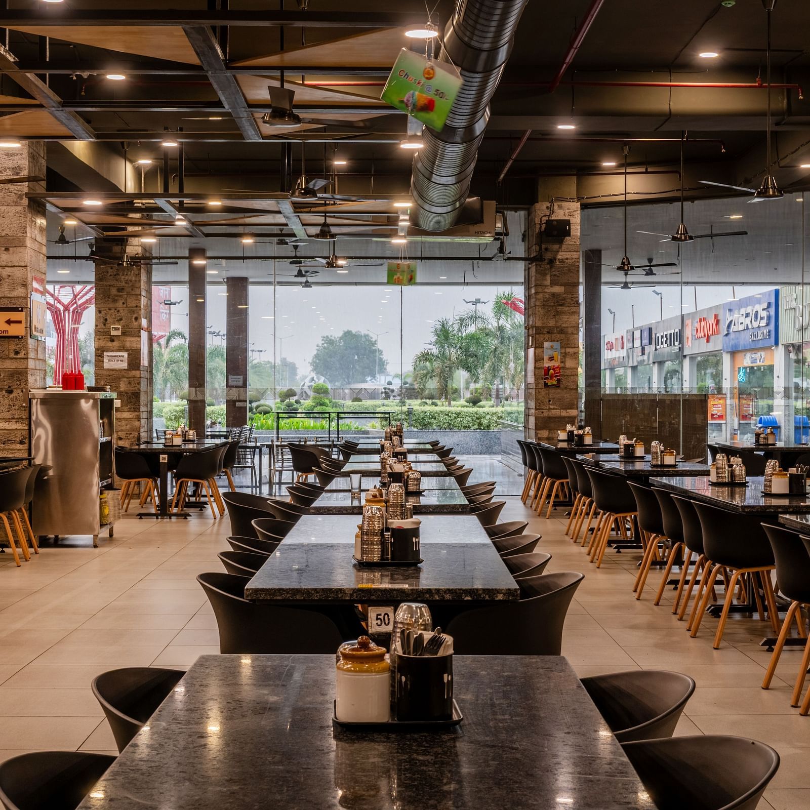 Restaurant seating area neatly arranged in elegant and simple manner at Hotel Highway King, Bilaspur