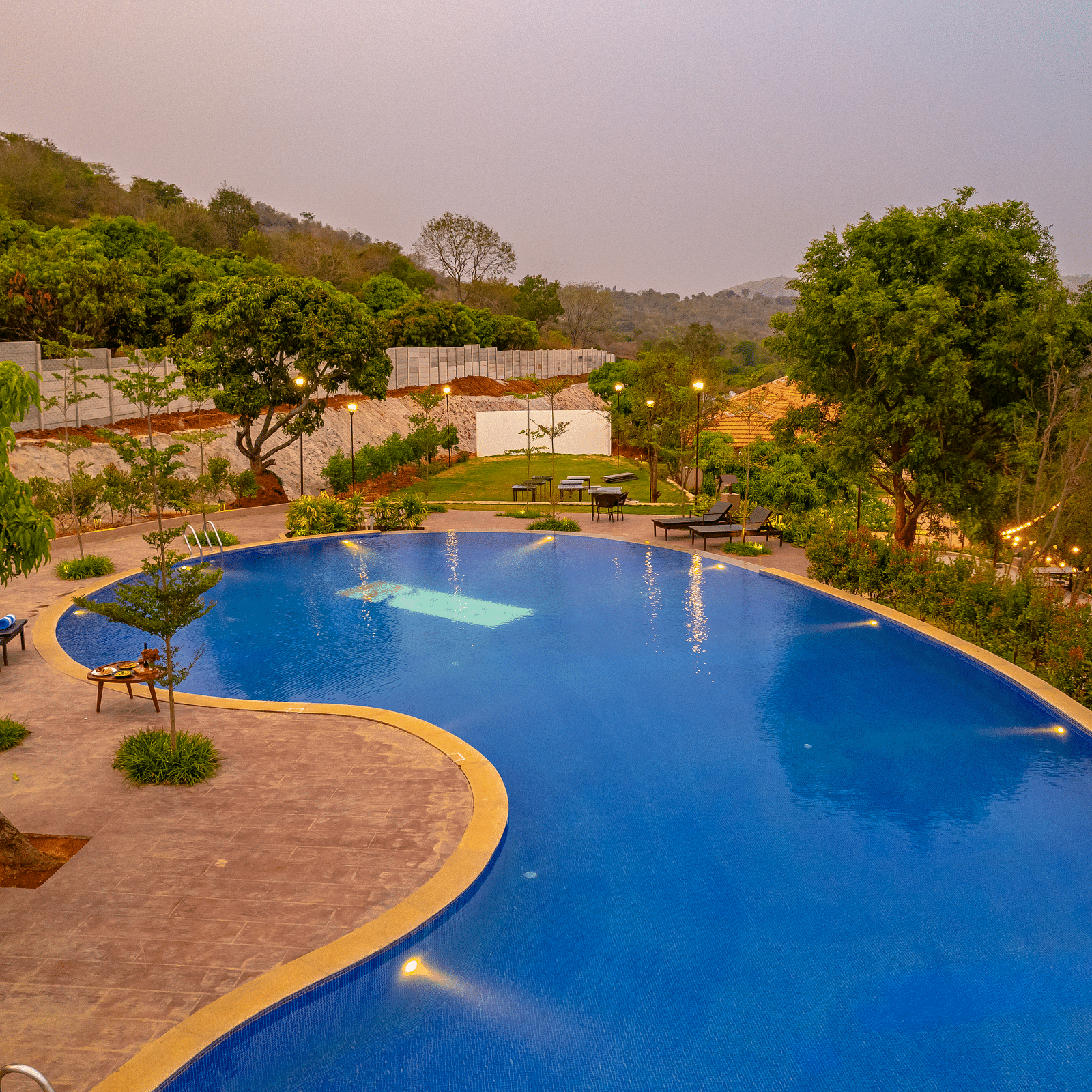 An aerial view of Ravishing Retreat featuring a large crystal blue swimming pool
