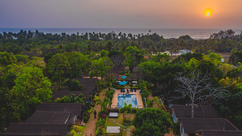 Aerial view of resort with sunset background  at Stone Wood Resort, Mandrem