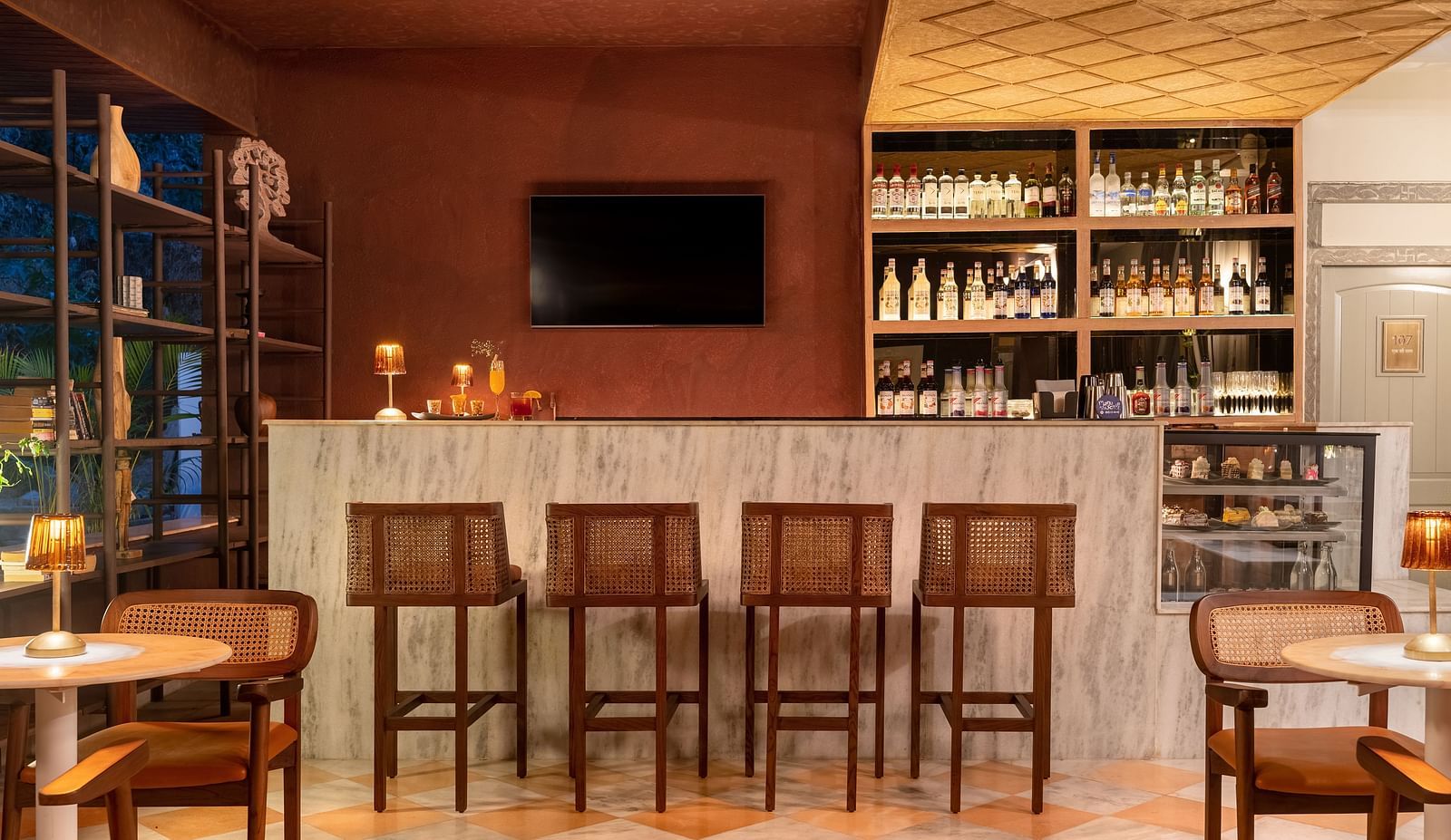 stools next to a bar counter inside one of the rooms - Manuscript - Jhilwara Haveli, Udiapur