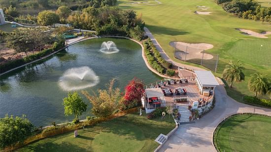 Overview of Lake 360 restaurant next to a lake at Karma Lakelands Gurgaon