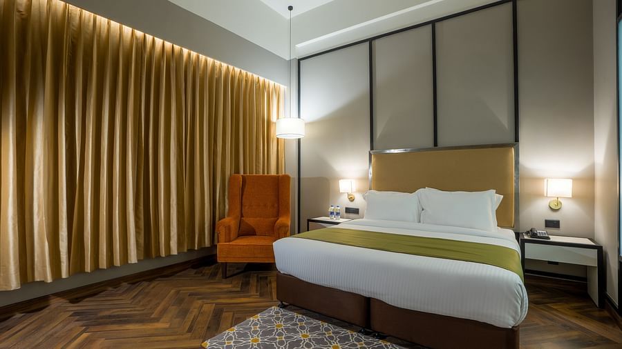 double bed in one of the rooms at Hotel Polo Towers Agartala