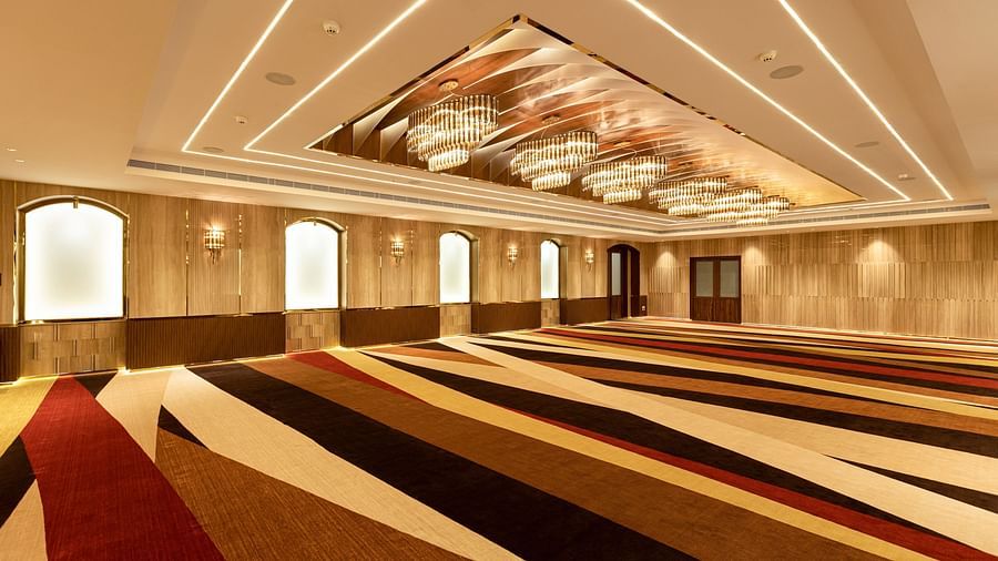 view of an empty hall with chandelier lights1