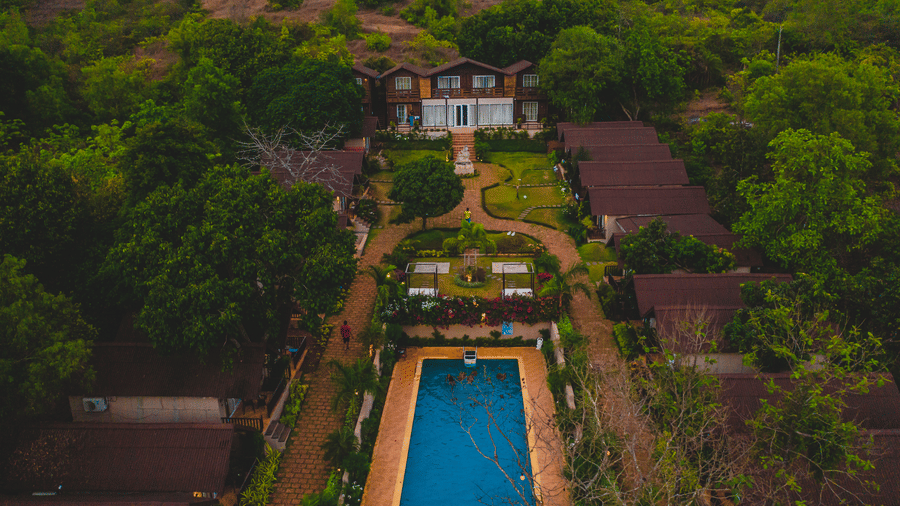 Aerial view of resort with sunset background at Stone Wood Resort, Mandrem