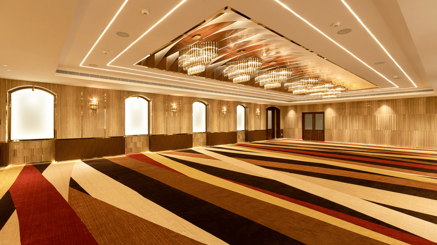 view of an empty hall with chandelier lights1