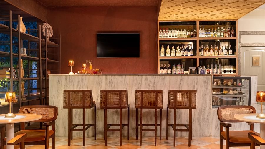 stools next to a bar counter inside one of the rooms - Manuscript - Jhilwara Haveli, Udiapur