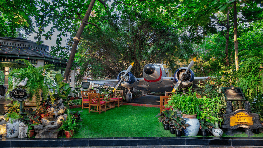 Lush green garden with golden Buddha sculpture and tropical landscaping at Mayfair Lagoon