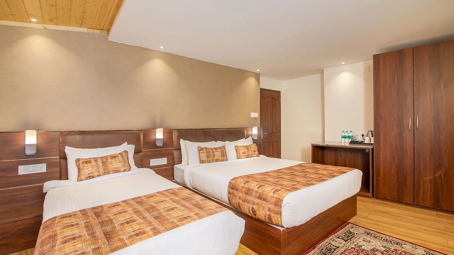An image of a room with two queen size beds, wardrobe, and minimal decoration - Sumitel Vista TV Tower