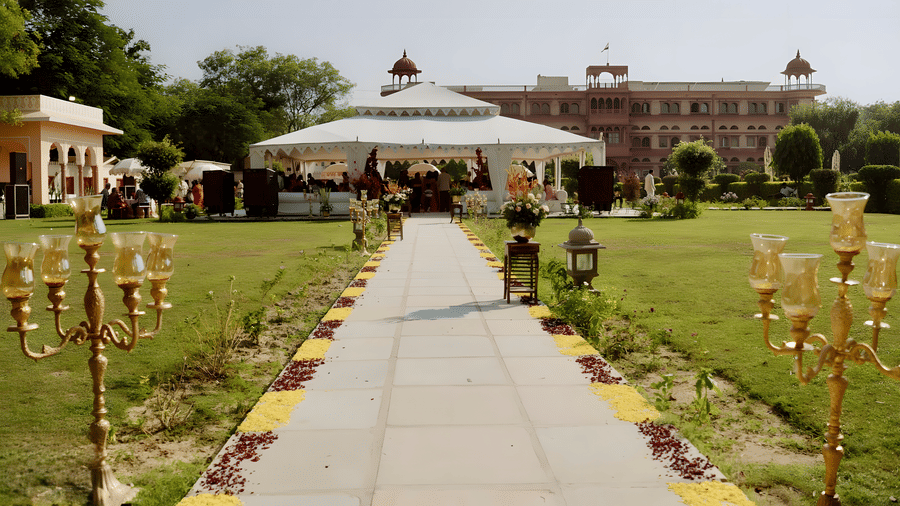 Outdoor pathway with floral decor leading to venue at Umaid Palace for Charvi & Dhruv wedding.