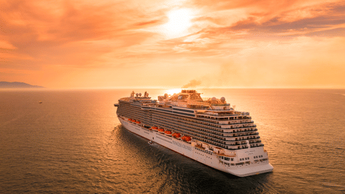 the cruise sailing through the ocean during the sunset